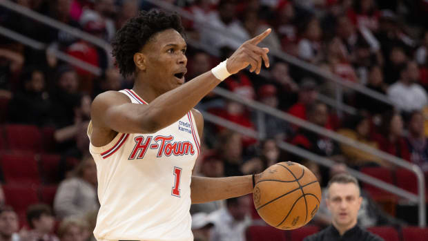 Rockets forward Amen Thompson (1) reacts while dribbling against the Toronto Raptors in the fourth quarter at Toyota Center.